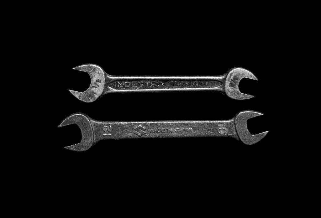 decorative image: two gray wrenches