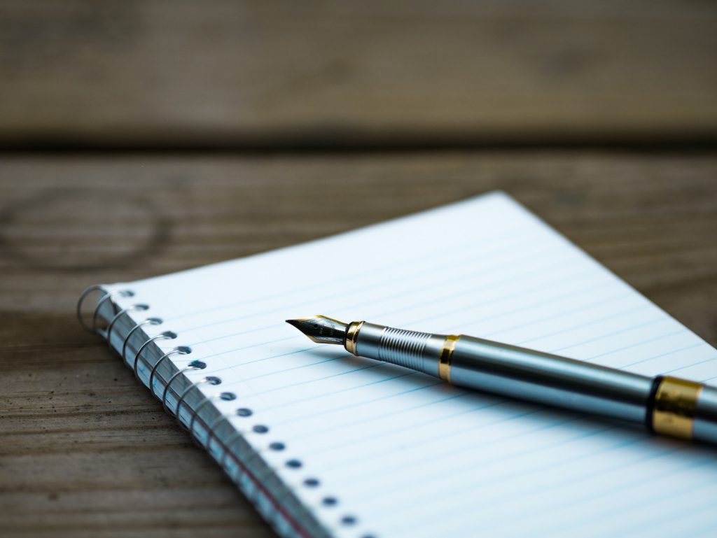 deco image: pen and notepad