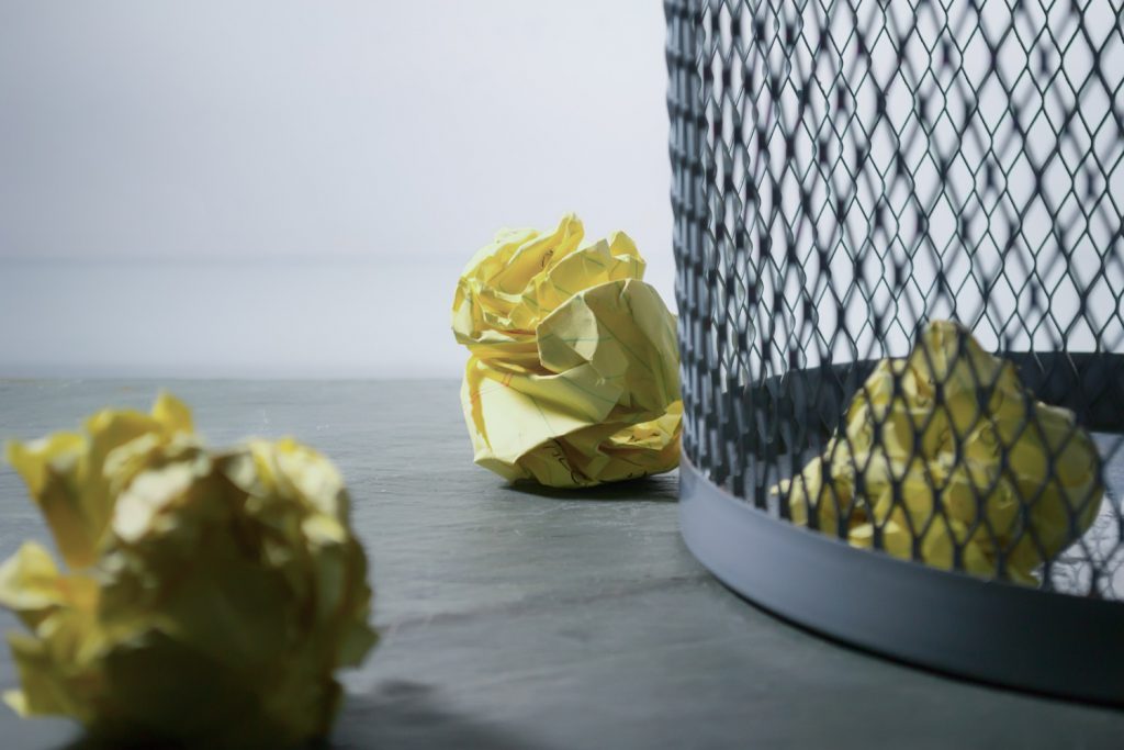 decorative image: crumbled paper in waste bin