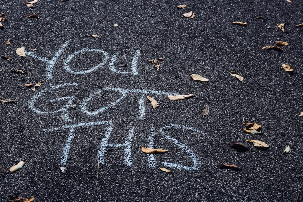 "You Got This" in chalk on concrete.