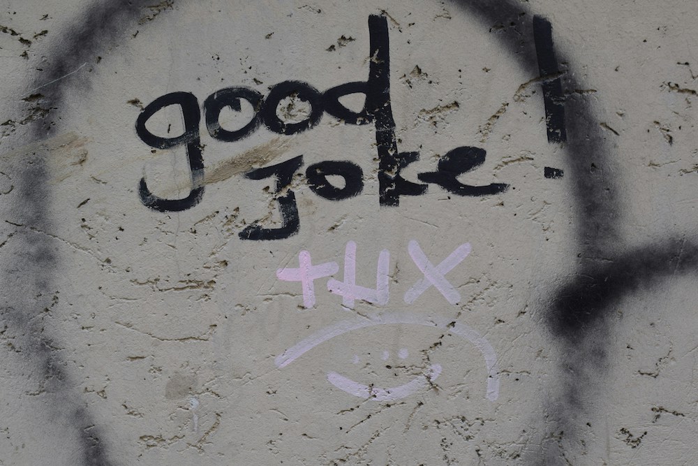 good laugh, thanks written on ground in paint