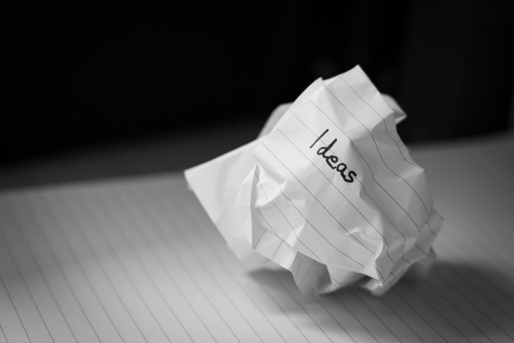 ideas written on crumpled sheet of paper.