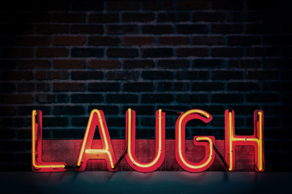 laugh in neon lights