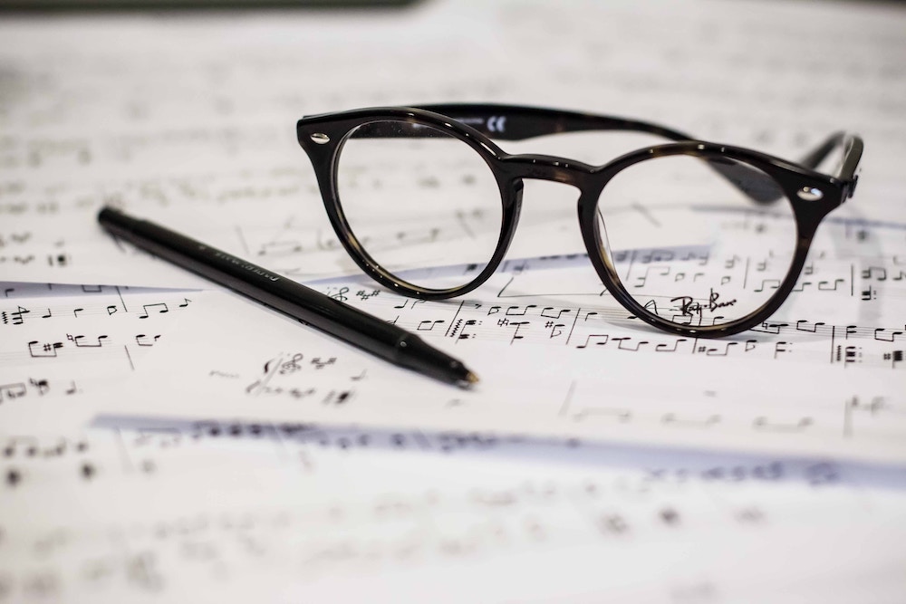 glass on top of sheet music